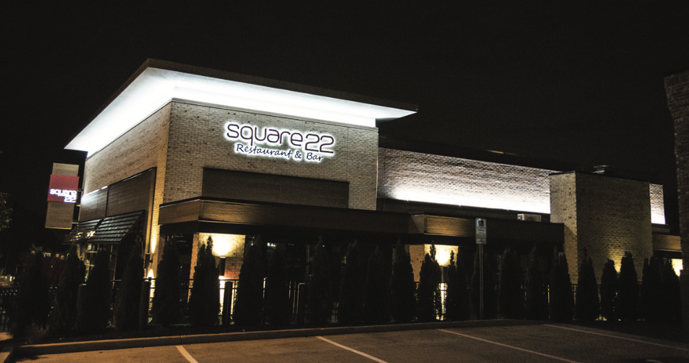Restaurant facade with architectural LED accents at night
